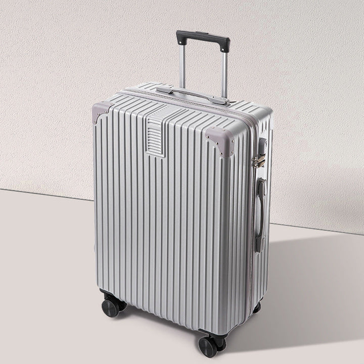 Pink hardshell carry-on suitcase with spinner wheels, a fashionable choice for travel.