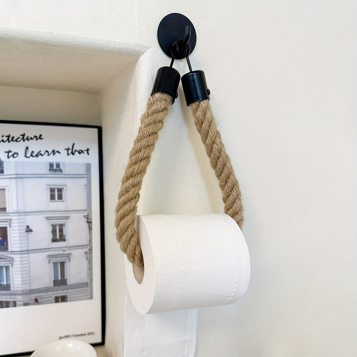 Handcrafted jute rope toilet paper holder, perfect for adding rustic charm to any bathroom wall.