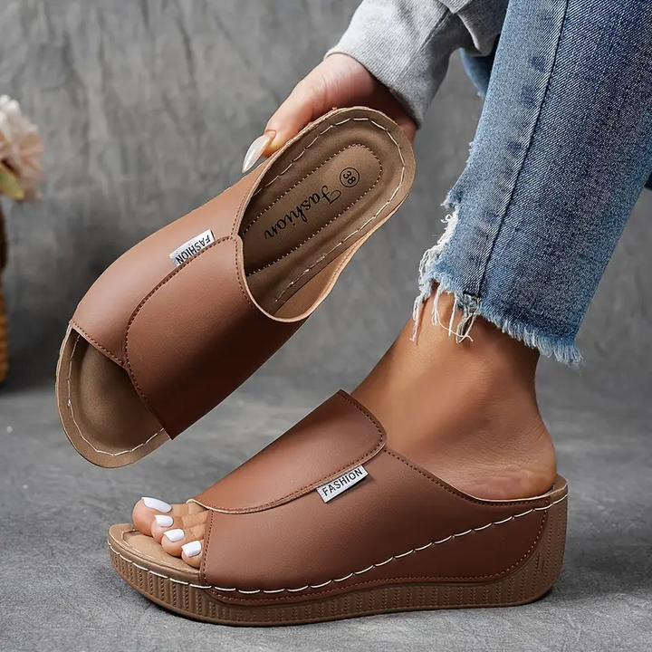 Women's comfort sandals with arch support, lightweight design & slip-resistant sole for everyday wear.