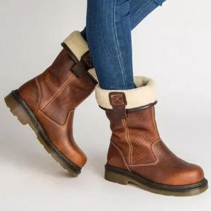 Stylish men's brown pull-on ankle boots with comfortable lug sole for all-day wear, perfect for fall and winter.