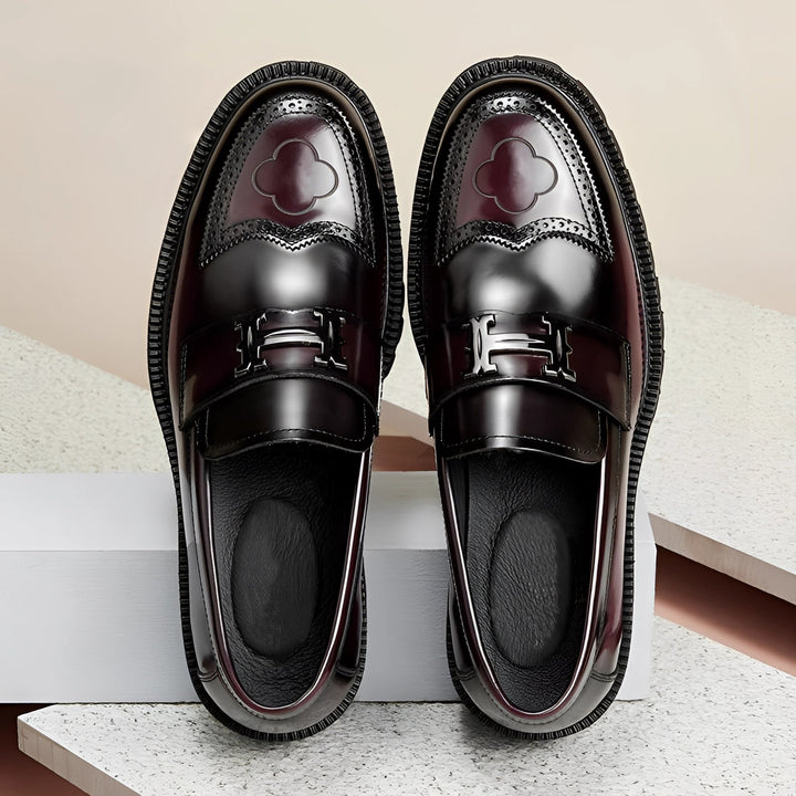 Elegant black men's designer loafers featuring a thick sole. Versatile comfort footwear for stylish business or casual looks.