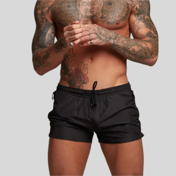 Athletic men's quick-dry swim trunks, comfortable and stylish for beach, pool, and watersports.