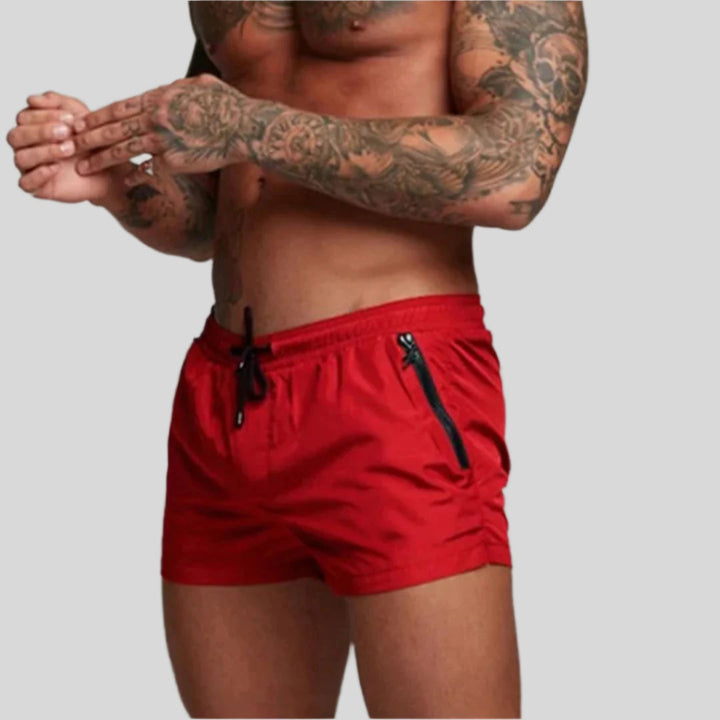 Blue quick-dry men's swim trunks, a stylish choice for beach, pool, and summer fashion.