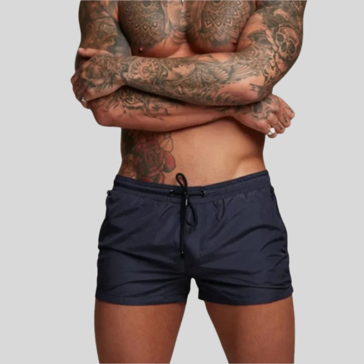 Modern quick-dry men's swim trunks for beach & pool. Stylish, comfortable & perfect for summer.