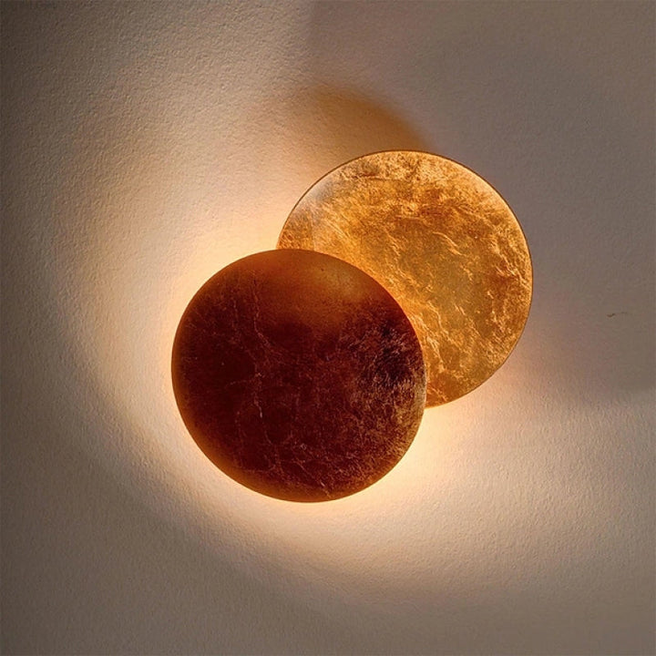Warm LED round wall sconce, modern Scandinavian style. Elegant indoor lighting for contemporary home ambiance.