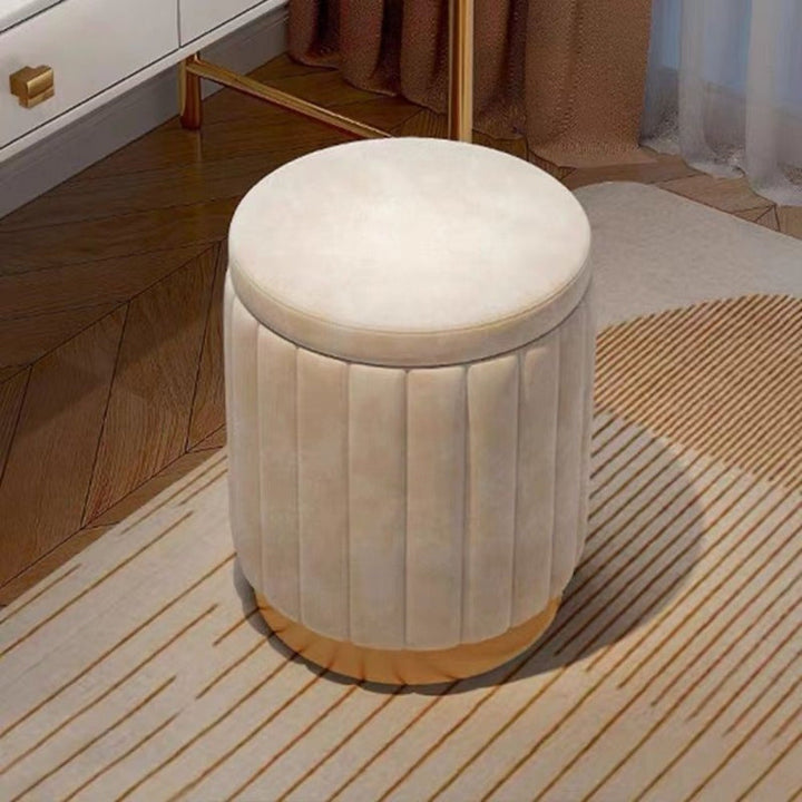 Elevate your home with this stylish round ottoman featuring a mirror finish