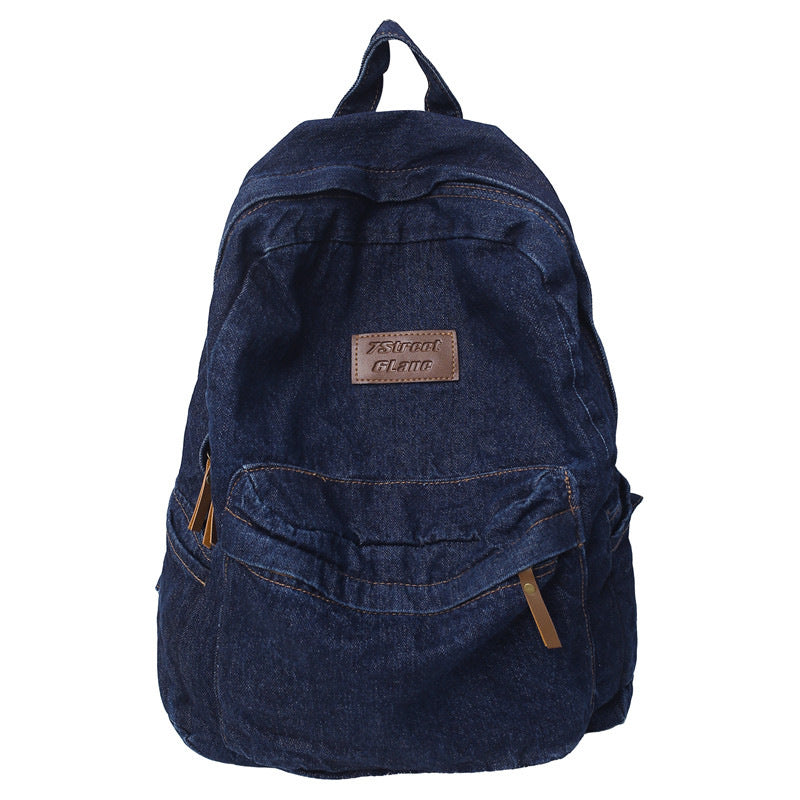 Stylish unisex denim travel school backpack for students, featuring a durable design and spacious compartments.