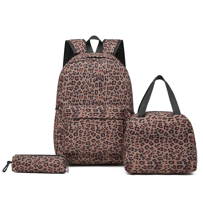 Multi-piece leopard print backpack set featuring a main pack, insulated cooler, & small pouch.
