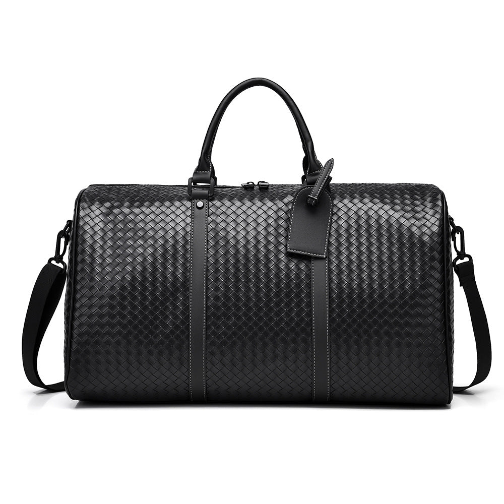 Stylish unisex woven leather duffle bag, perfect for weekend travel & carry-on. Durable & chic.
