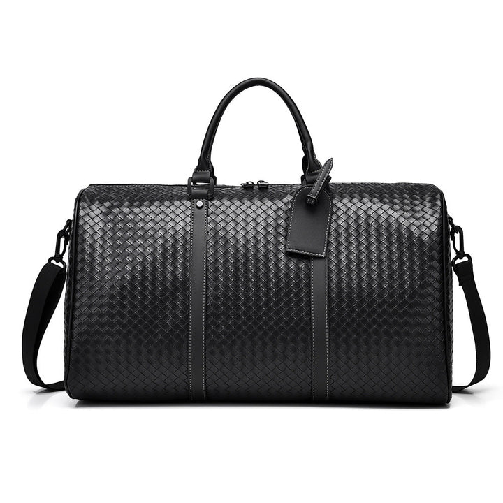 Stylish unisex woven leather duffle bag, perfect for weekend travel & carry-on. Durable & chic.
