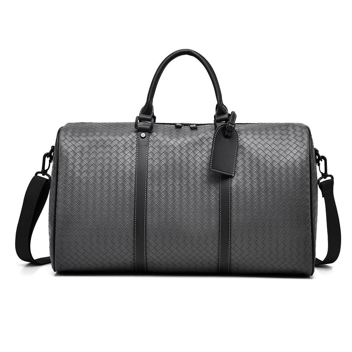 Luxurious woven leather duffle bag, a unisex carry-on for stylish weekend travel & overnight stays.