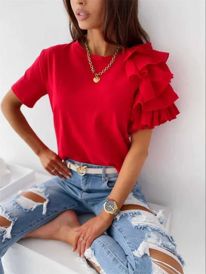 Stylish women's asymmetrical ruffle short sleeve top with a round neck. Perfect for casual spring/summer fashion.