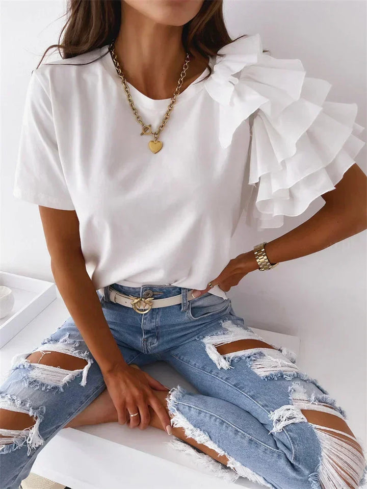 Fashionable women's short sleeve top featuring an asymmetrical hem and ruffle sleeves, great for everyday style.