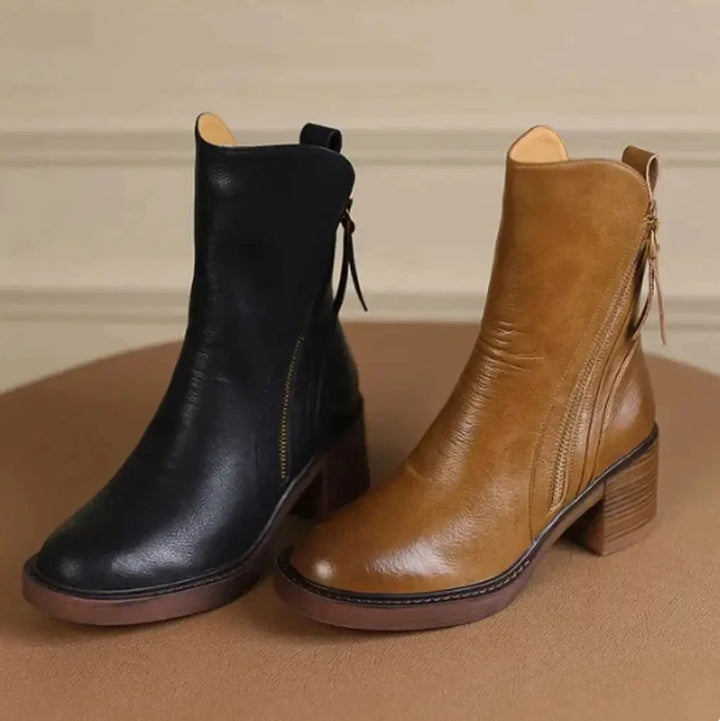 Fashionable women's leather side-zip ankle boots. Elegant block heel design, ideal for casual or dressy outfits.