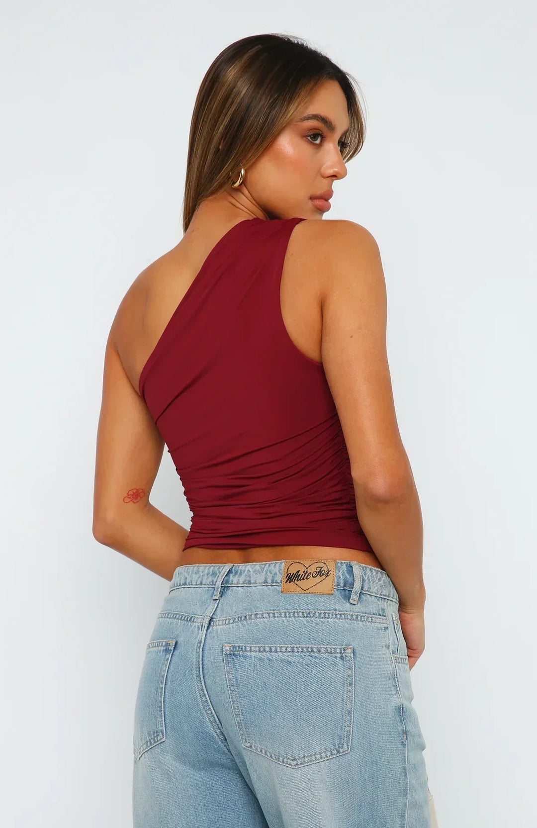 Elegant white one shoulder ruched crop top, perfect for date night. Sleeveless bodycon evening wear.