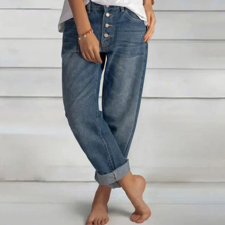 Stylish women's blue loose-fit high-waist jeans, perfect for comfortable everyday casual wear.