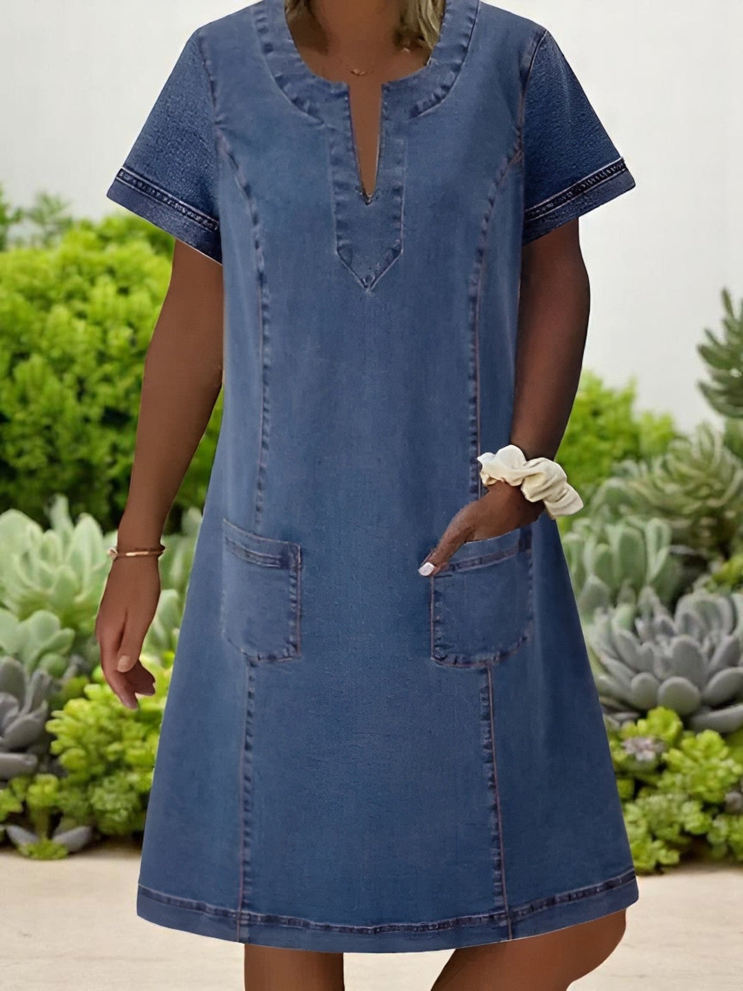 Stylish women's blue short sleeve shift mini dress, perfect for casual everyday wear. Comfortable spring/summer fashion.