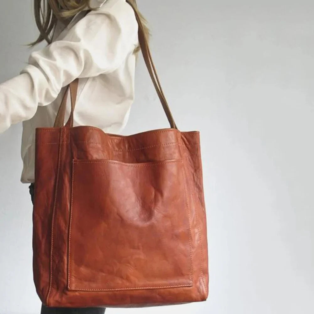 Dark brown leather tote bag for women, a versatile shoulder bag with secure magnetic closure for daily wear.