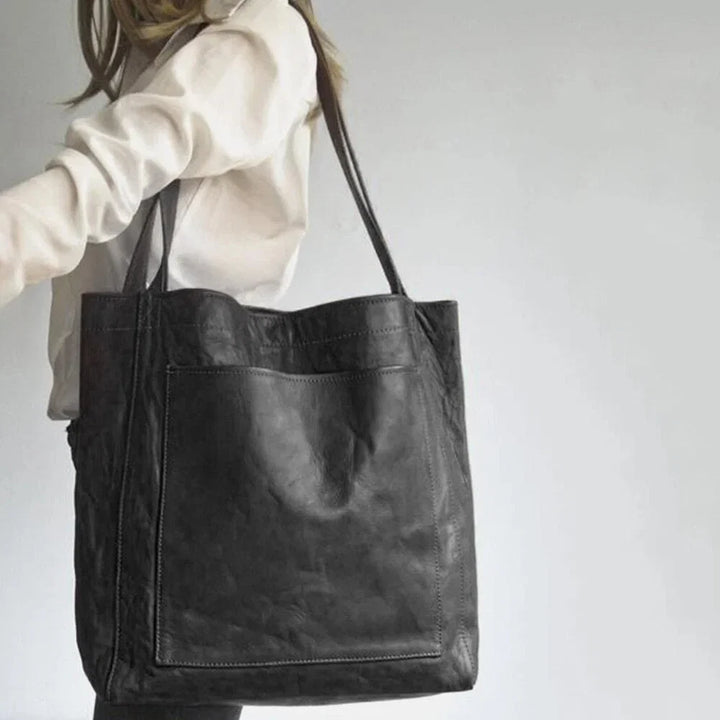 Elegant women's leather tote shoulder bag, featuring a magnetic closure, ideal for work and everyday style.