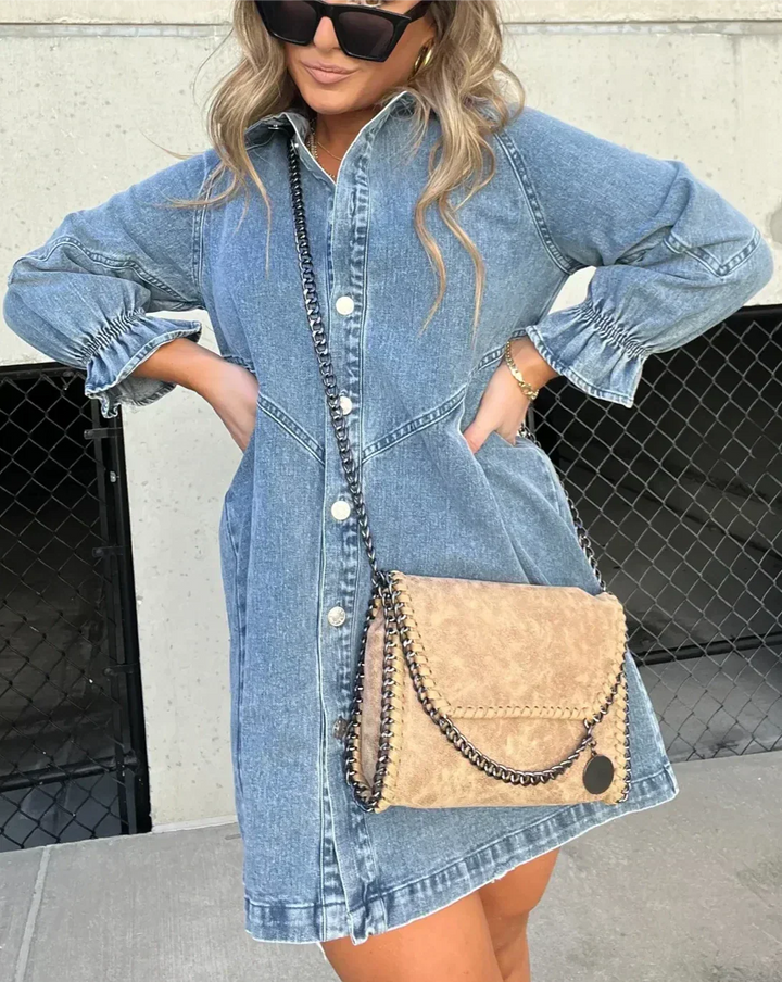 Fashionable women's button-down mini dress, great for casual summer days. Features charming ruffle sleeve detail.