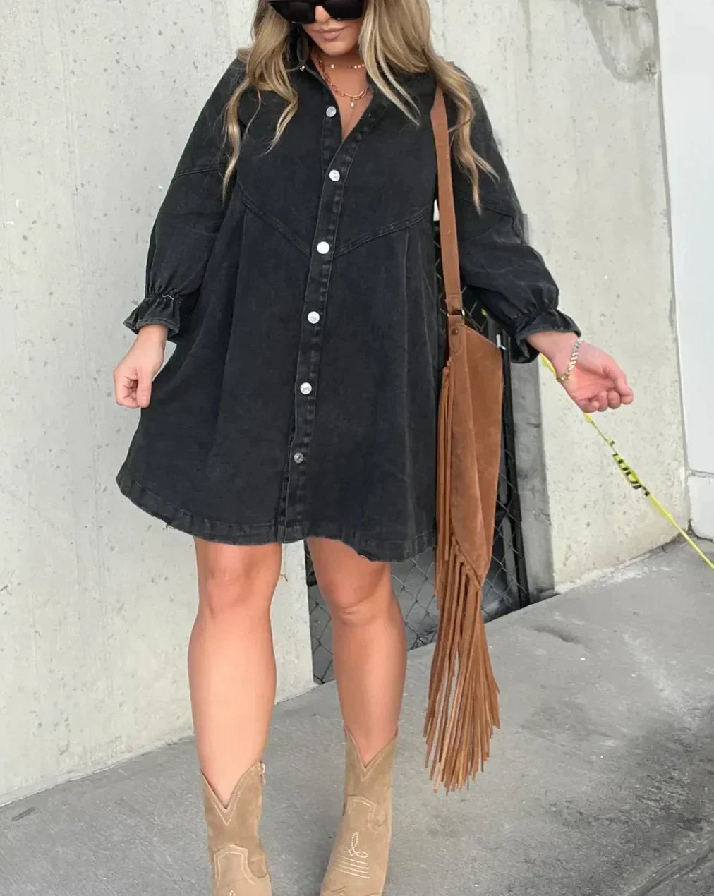 Lightweight women's button-down mini dress. Features comfortable ruffle sleeves, ideal for stylish summer outfits.