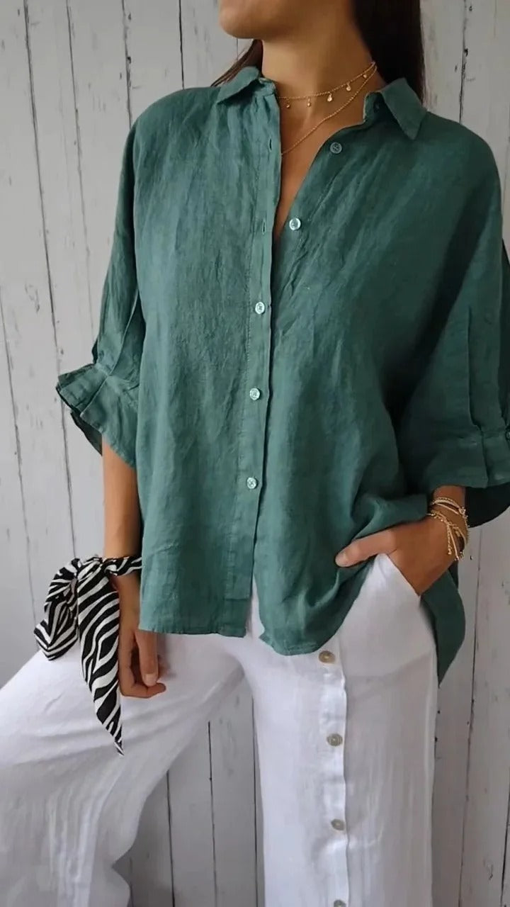 Elegant women's button-up shirt, long sleeve, relaxed fit, combining comfort with modern ladies fashion.