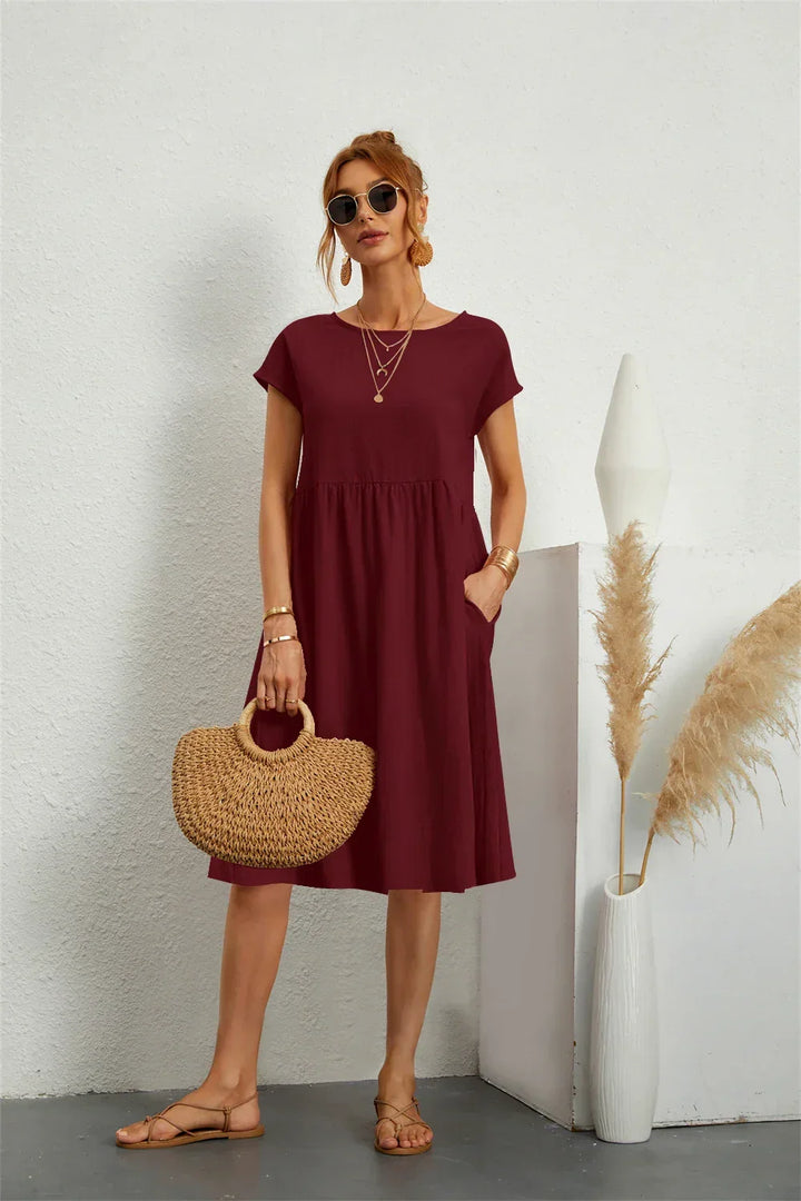 Modern women's casual midi dress with pockets, comfortable & stylish for versatile everyday fashion.