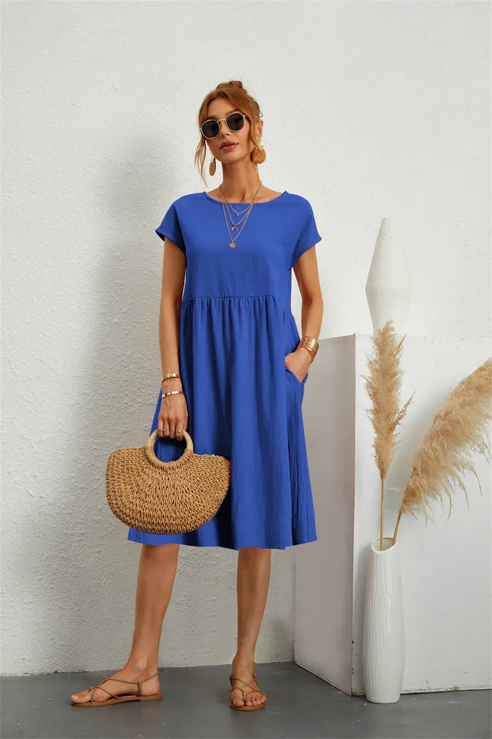 Front view of a women's stylish casual midi dress with pockets, offering everyday comfort & relaxed fit.