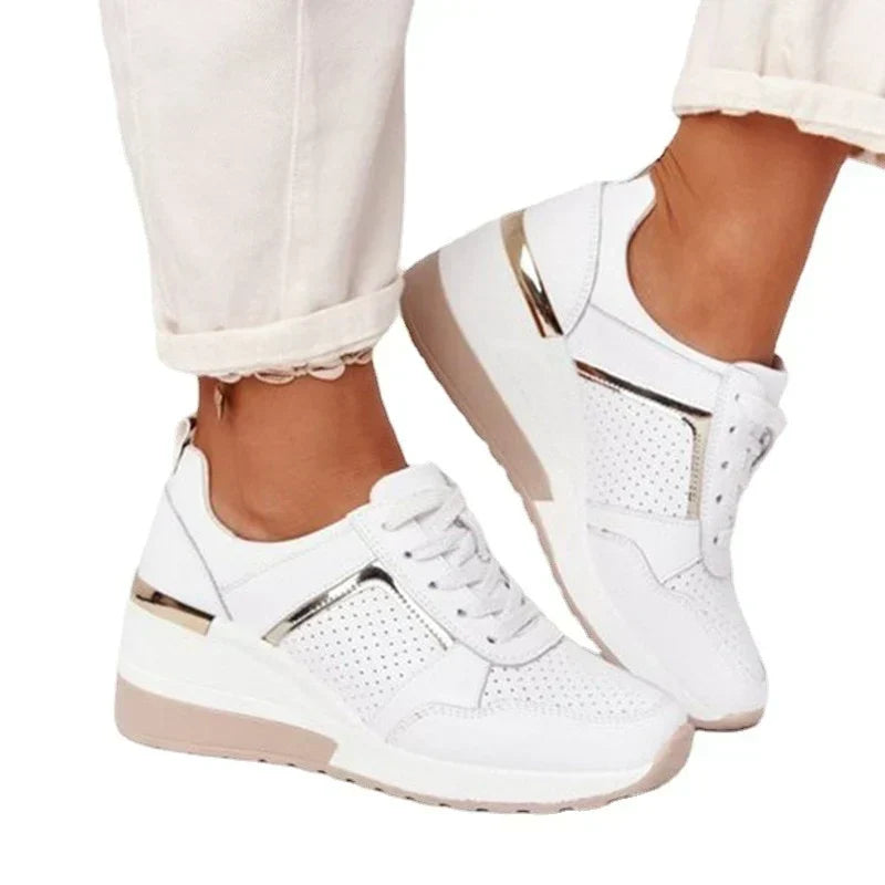 Lightweight women's walking sneakers, offering supportive comfort and a breathable athletic style.