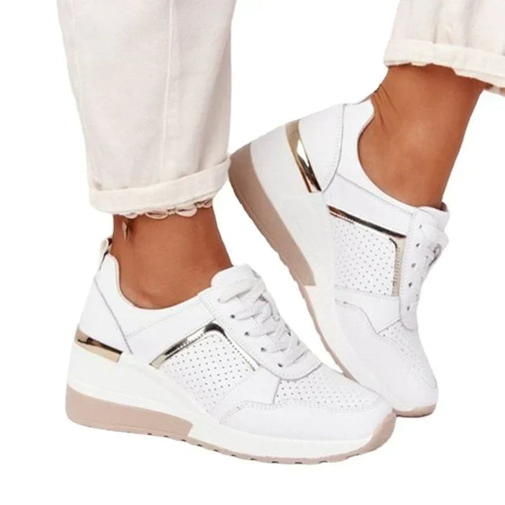 Lightweight women's walking sneakers, offering supportive comfort and a breathable athletic style.