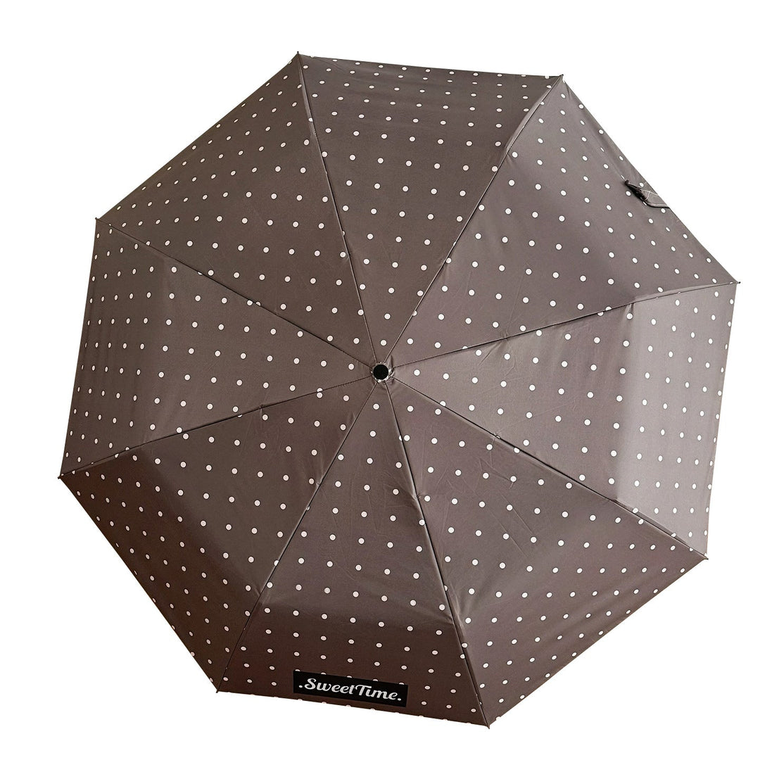 Navy blue compact travel umbrella for women, strong waterproof protection.