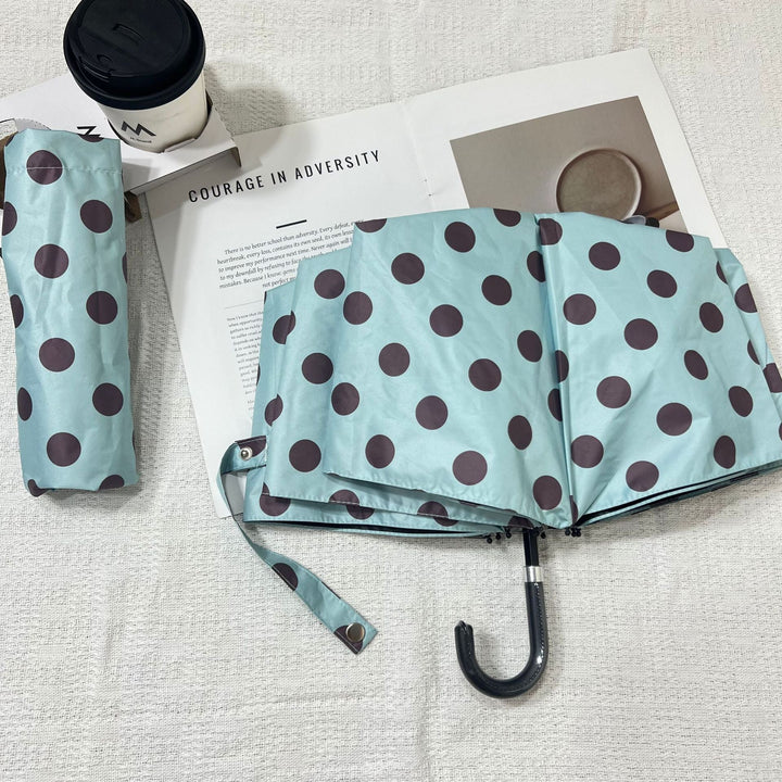 Compact women's rain umbrella, durable & lightweight for everyday use.