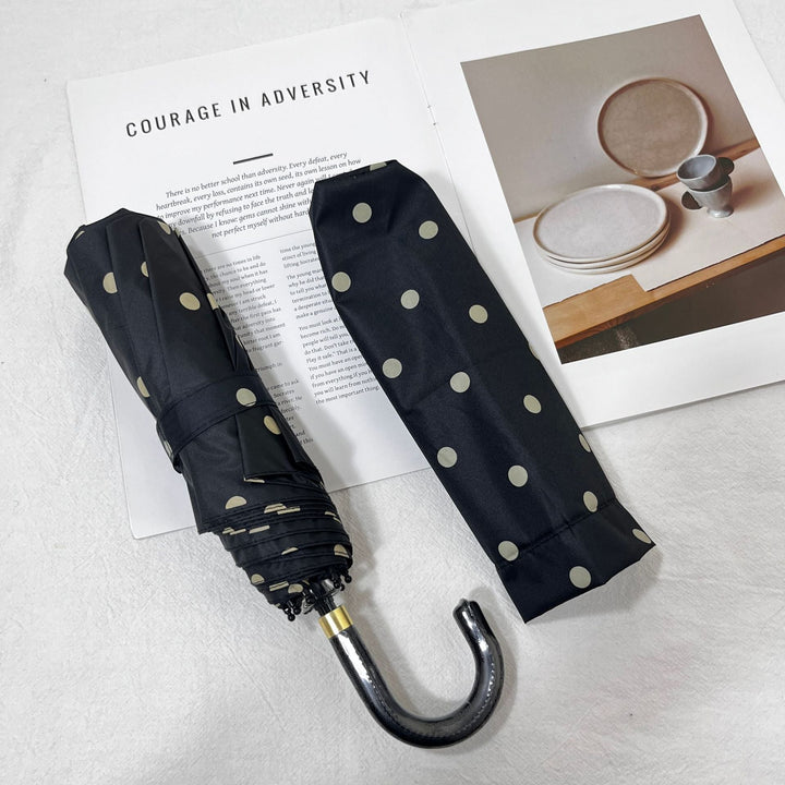 Waterproof folding umbrella for women, small and portable for unexpected rain.