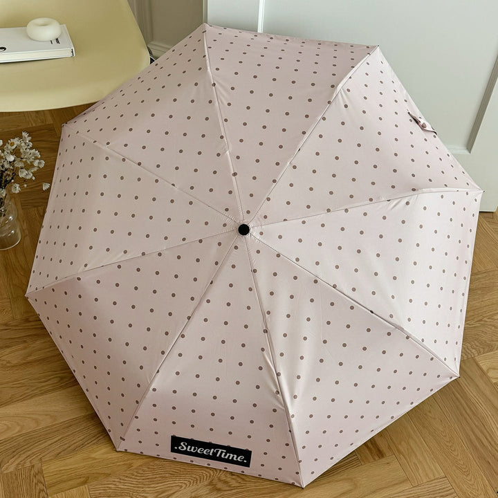 Portable folding umbrella for women, ideal for travel, waterproof & durable.
