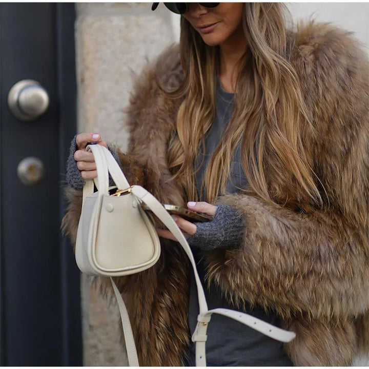 Cozy, stylish women's cropped winter jacket, a fashionable layering piece for cold weather outerwear.