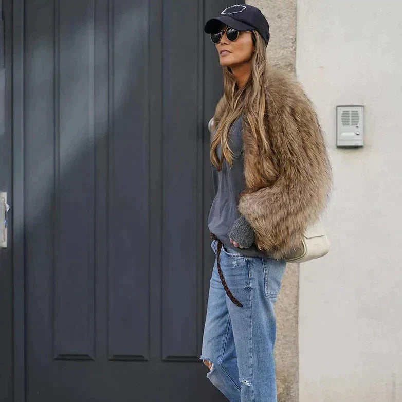 Elegant women's cropped winter jacket, a chic fashion statement for trendy looks and sophisticated winter outfits.