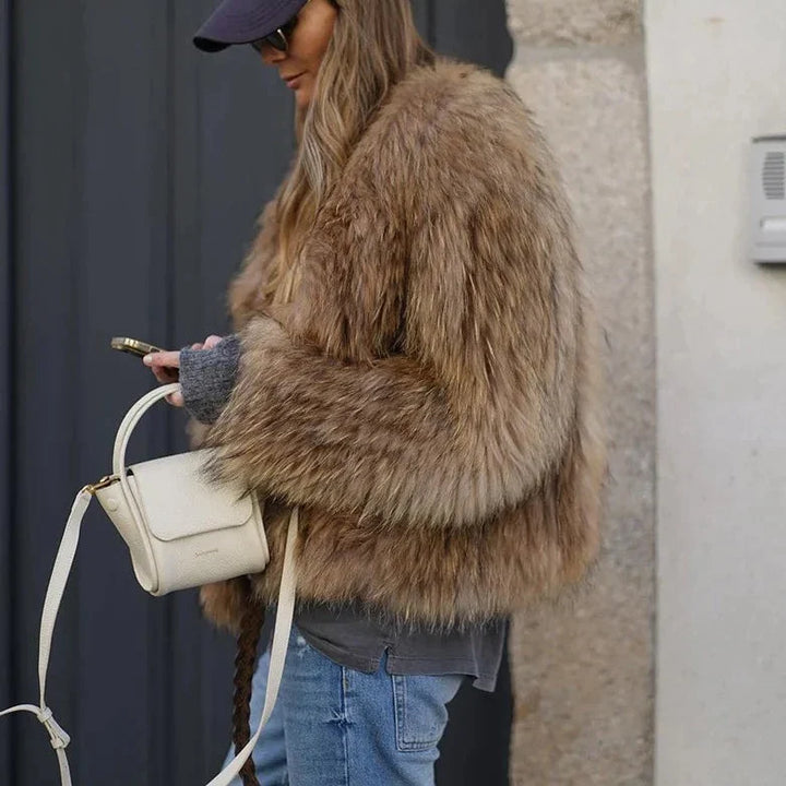 Trendy women's cropped winter jacket, providing warmth and style for casual chic and elegant cold-weather fashion.