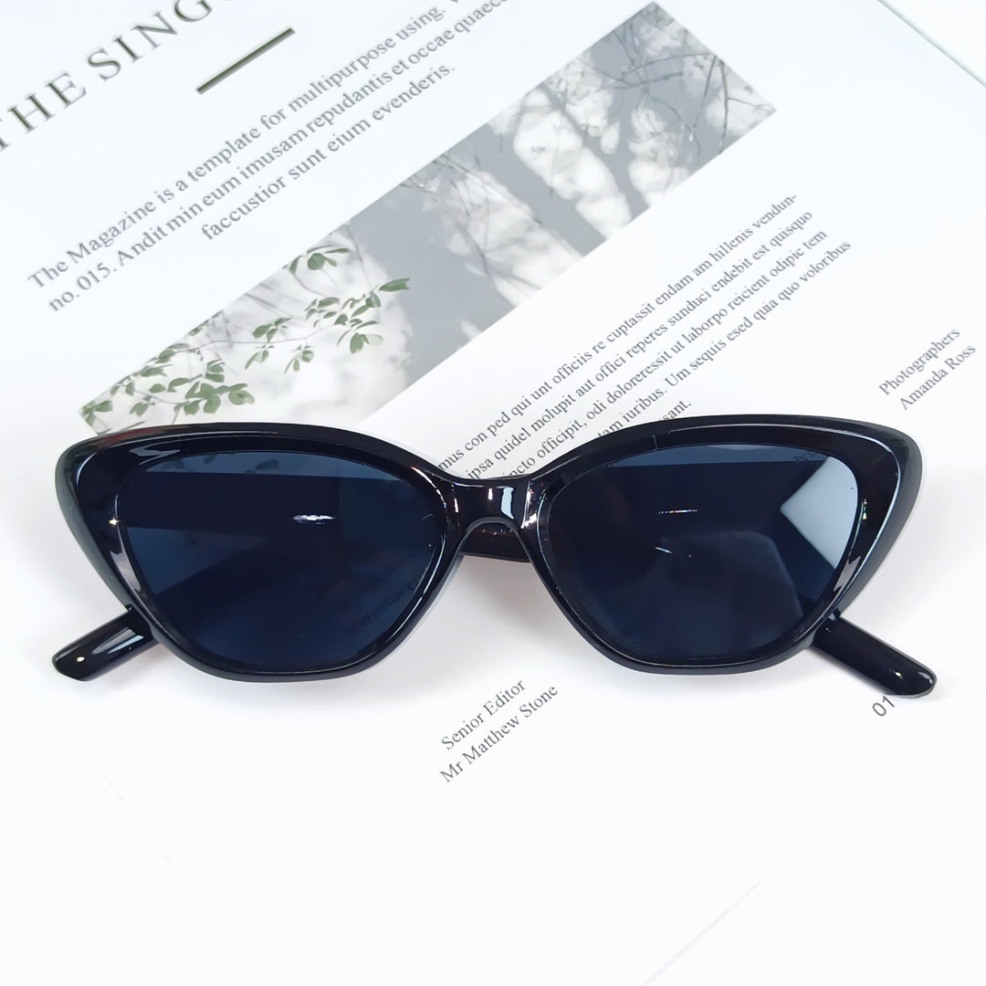 Stylish women's designer sunglasses with UV protection, modern angled frame eyewear.
