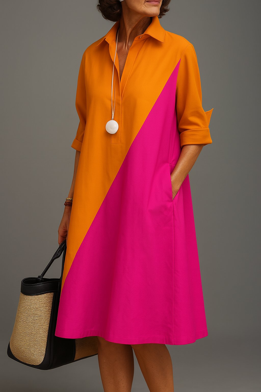 Stylish women's diagonal colourblock midi dress featuring a chic collared V-neck and flattering A-line silhouette.