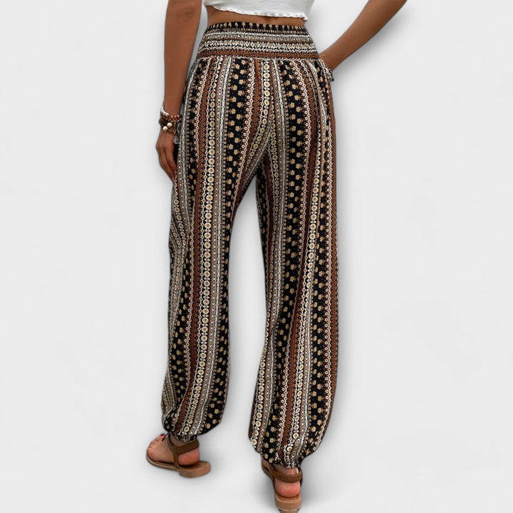 Close-up of intricate ethnic graphic pattern on comfortable women's fashion trousers.