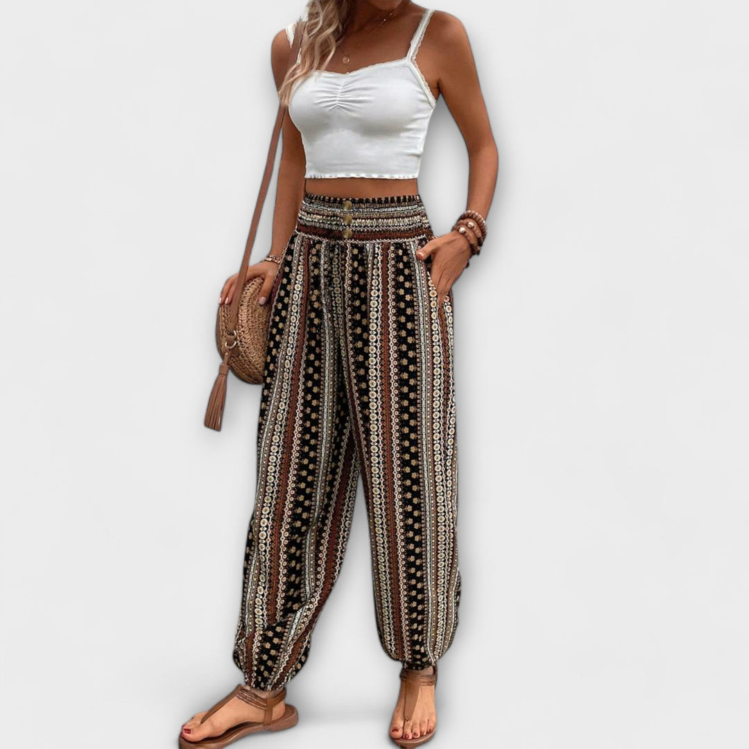 Model wearing chic women's ethnic patterned trousers, perfect for a bohemian casual look.