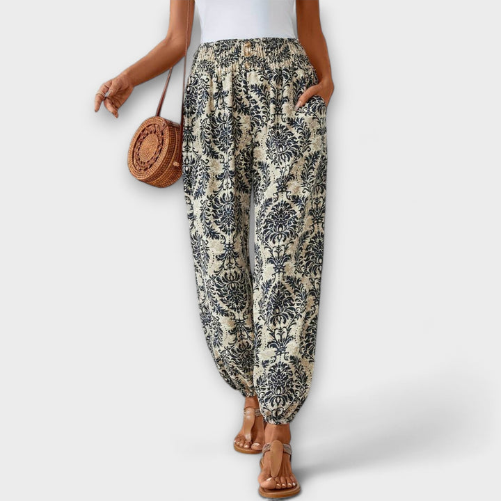Detail shot of the waistband and comfortable fit of these women's ethnic patterned pants.