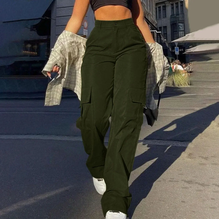 Woman modeling high-waist cargo pants, showcasing comfortable movement and practical pockets for active wear.