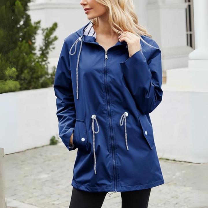 Women's longline hooded jacket with adjustable waist drawstrings, a comfortable & stylish outerwear option.