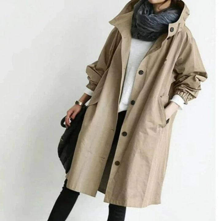 Lightweight weatherproof women's long rain jacket, a stylish hooded coat ideal for spring and fall.
