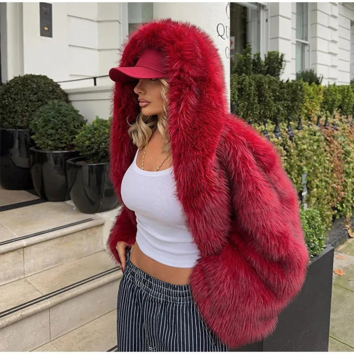 Chic women's faux hooded coat, offering long sleeve comfort. A stylish and warm piece for fall and winter.