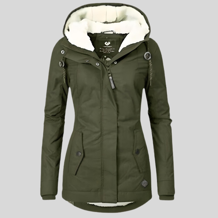 Woman wearing a warm, waterproof, longline winter coat. Insulated jacket for cold weather protection.