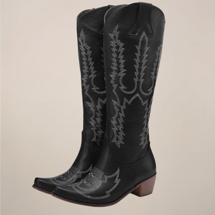 Embroidered women's knee-high cowboy boots. Stylish Western pull-on footwear with a sturdy block heel.