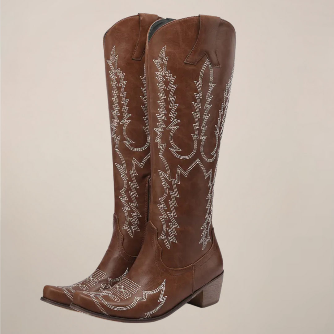 Classic women's Western knee-high boots. Fashionable pull-on cowboy boots with intricate stitching & a block heel.