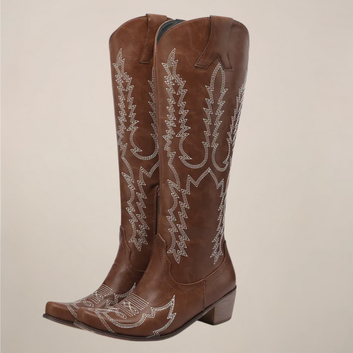 Classic women's Western knee-high boots. Fashionable pull-on cowboy boots with intricate stitching & a block heel.